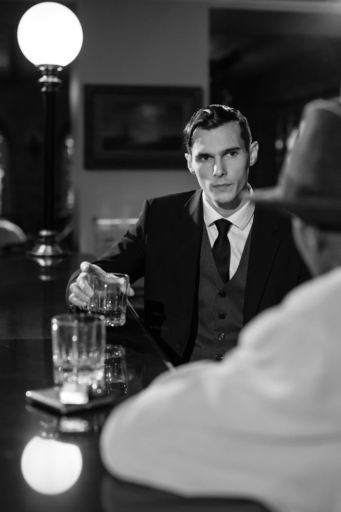 A mysterious noir-style scene with two men in a bar, capturing a cinematic and moody atmosphere.